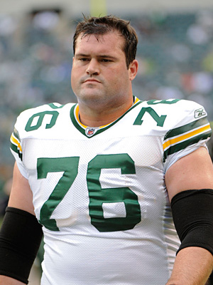 "A picture of Chad Clifton in a white Packers uniform
"